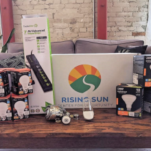 Light bulbs on display with a Rising Sun sign