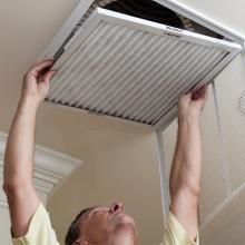 man changing a filter.