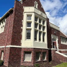 old red brick building with bike racks
